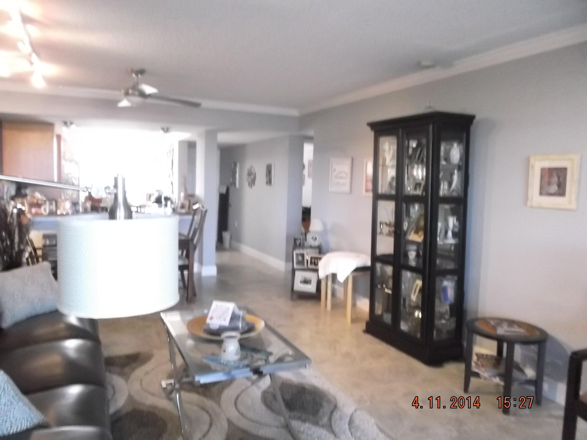 6133 Balboa Circle, Unit 405 Boca Raton, FL 33433 - Photo 11 of 36 a living room with lots of furniture and view of kitchen