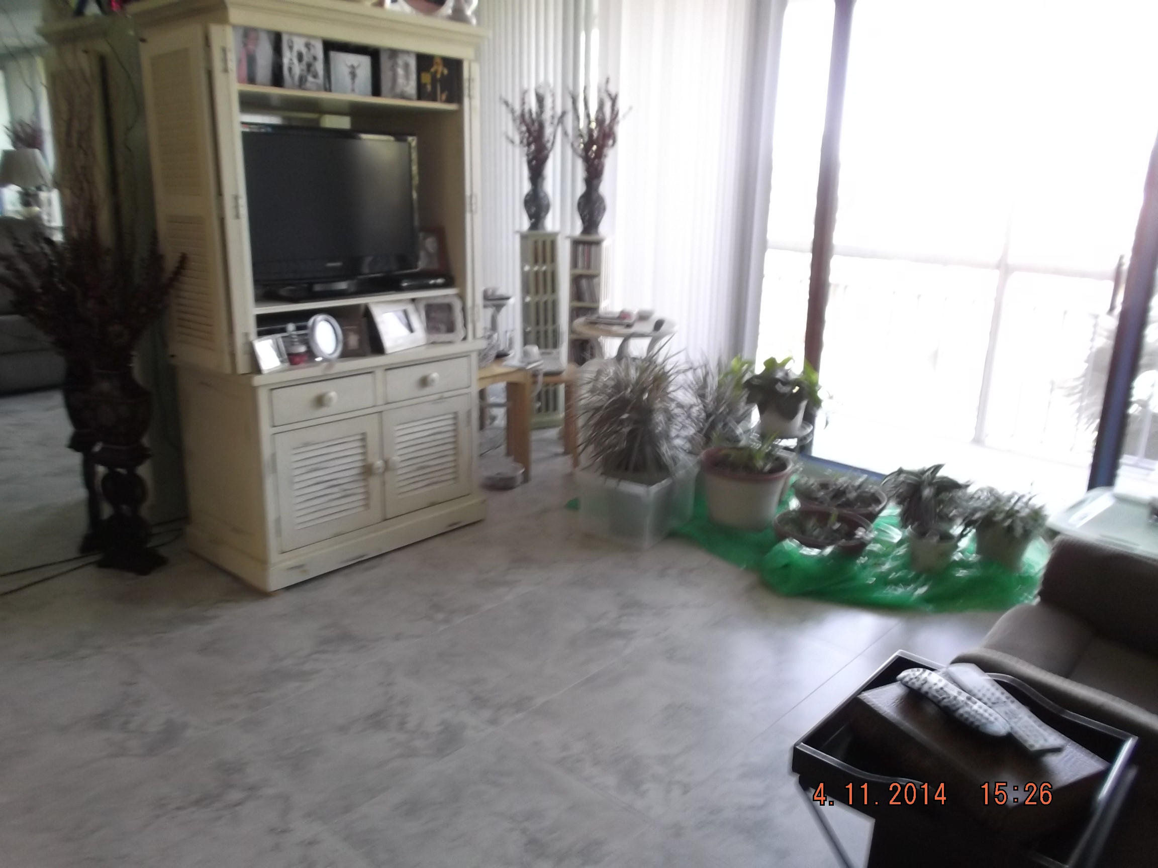 6133 Balboa Circle, Unit 405 Boca Raton, FL 33433 - Photo 13 of 36 a living room with furniture and a flat screen tv