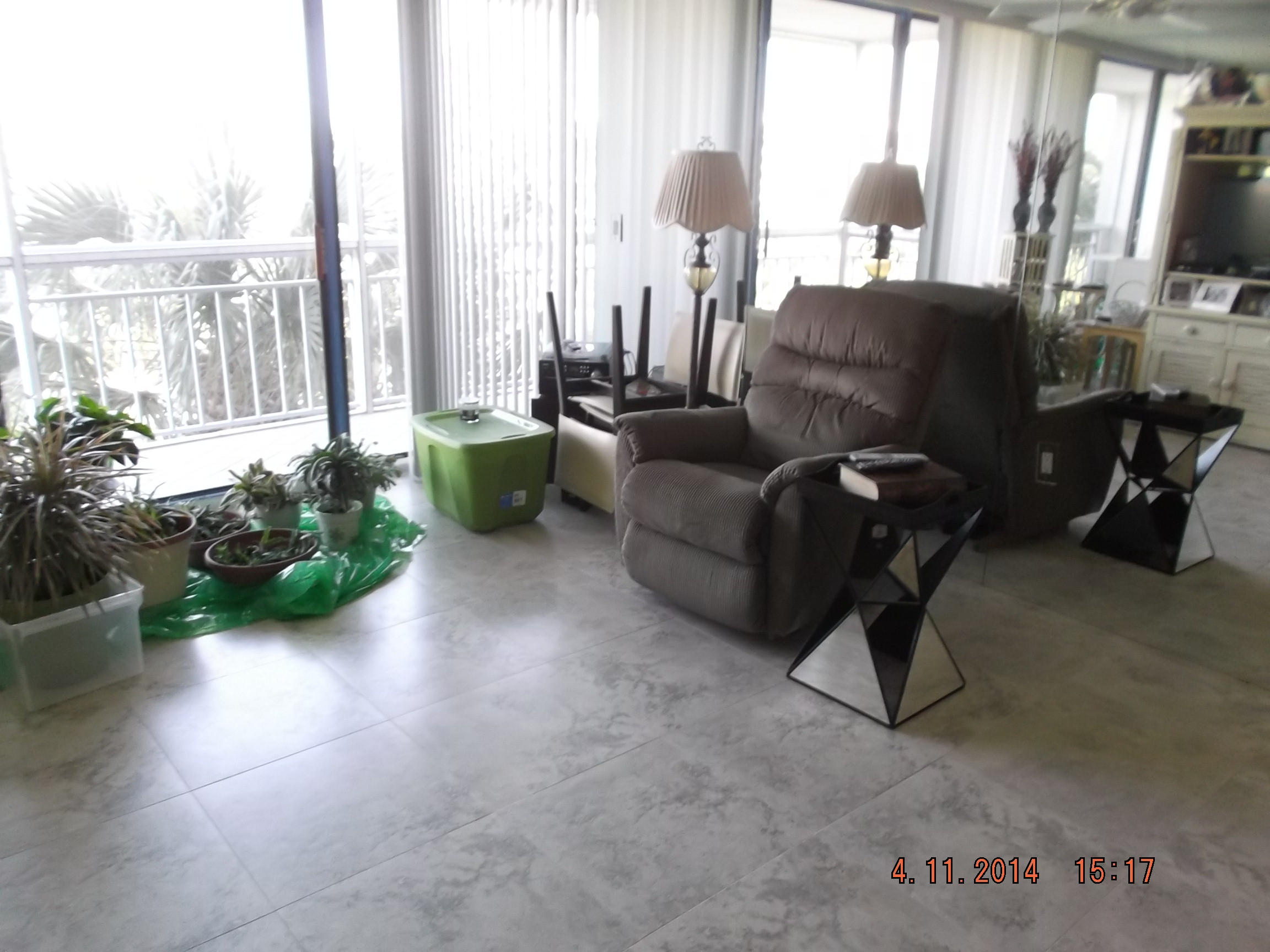 6133 Balboa Circle, Unit 405 Boca Raton, FL 33433 - Photo 14 of 36 a living room with furniture and a large window