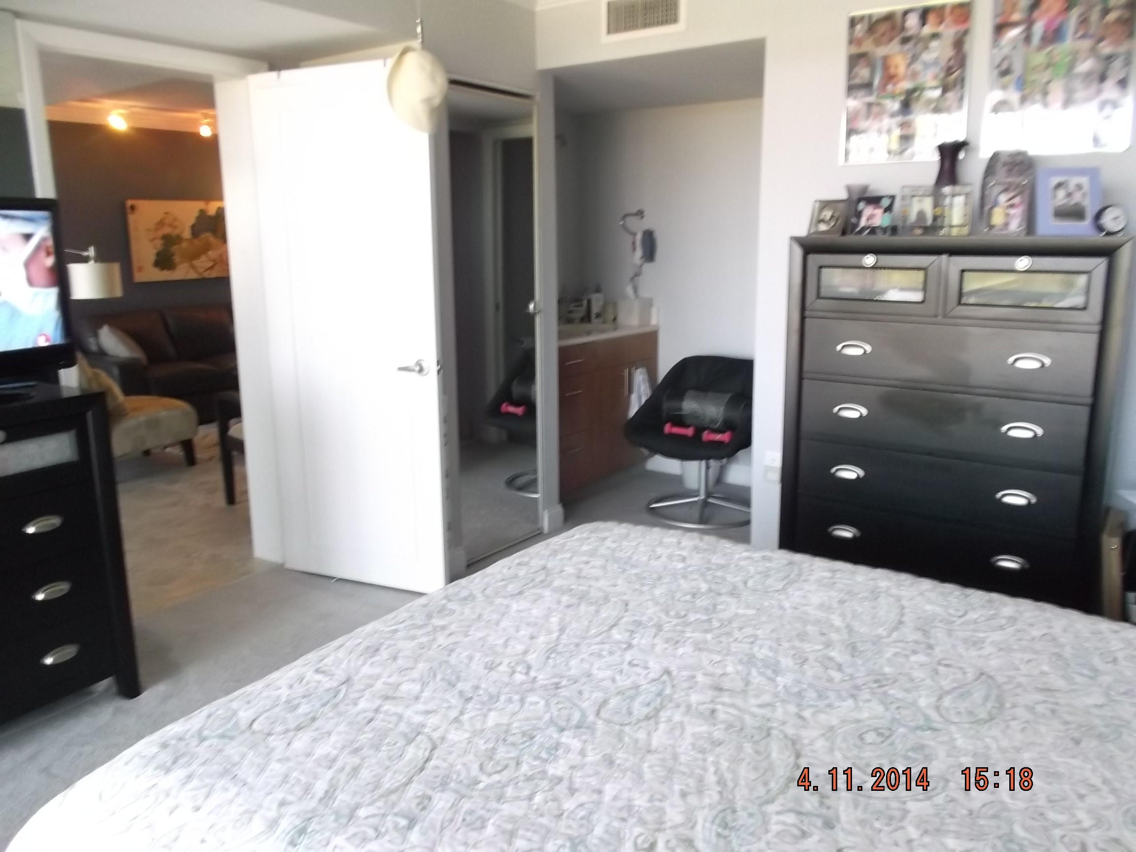 6133 Balboa Circle, Unit 405 Boca Raton, FL 33433 - Photo 16 of 36 a bedroom with a bed and a television