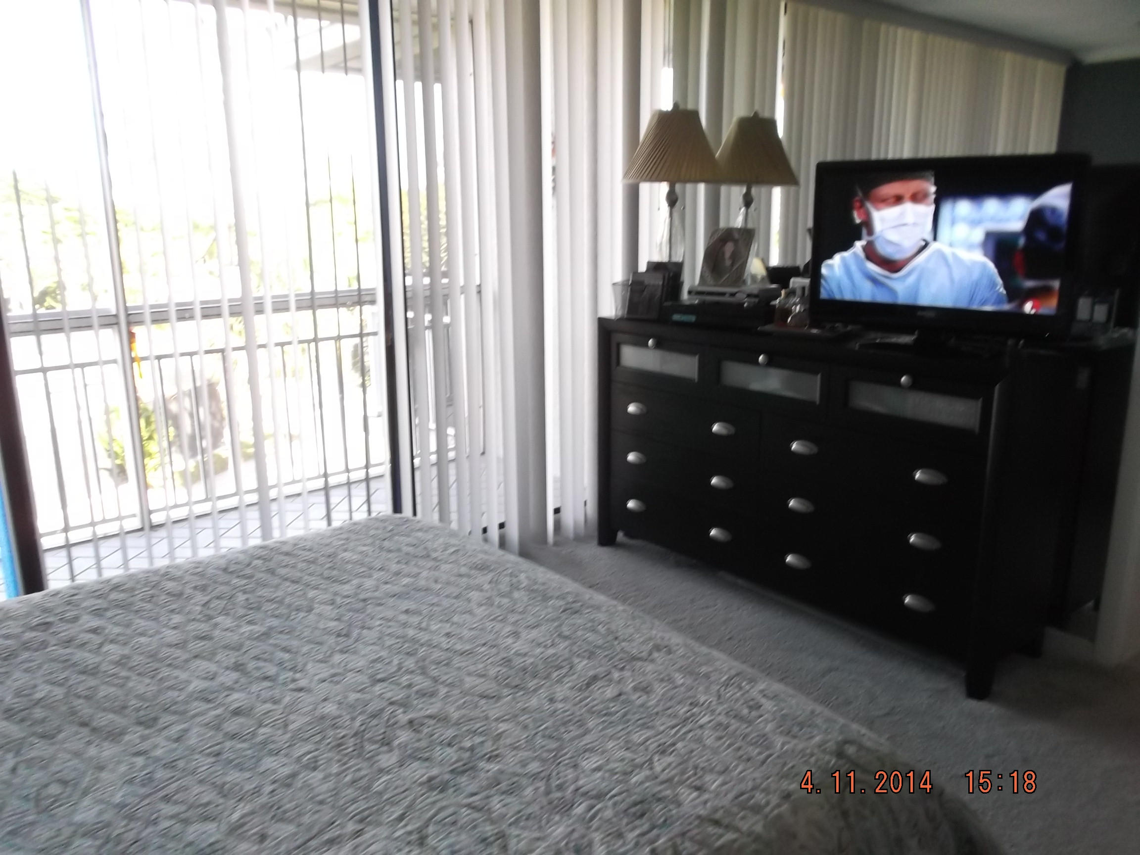 6133 Balboa Circle, Unit 405 Boca Raton, FL 33433 - Photo 17 of 36 a living room with furniture and a flat screen tv