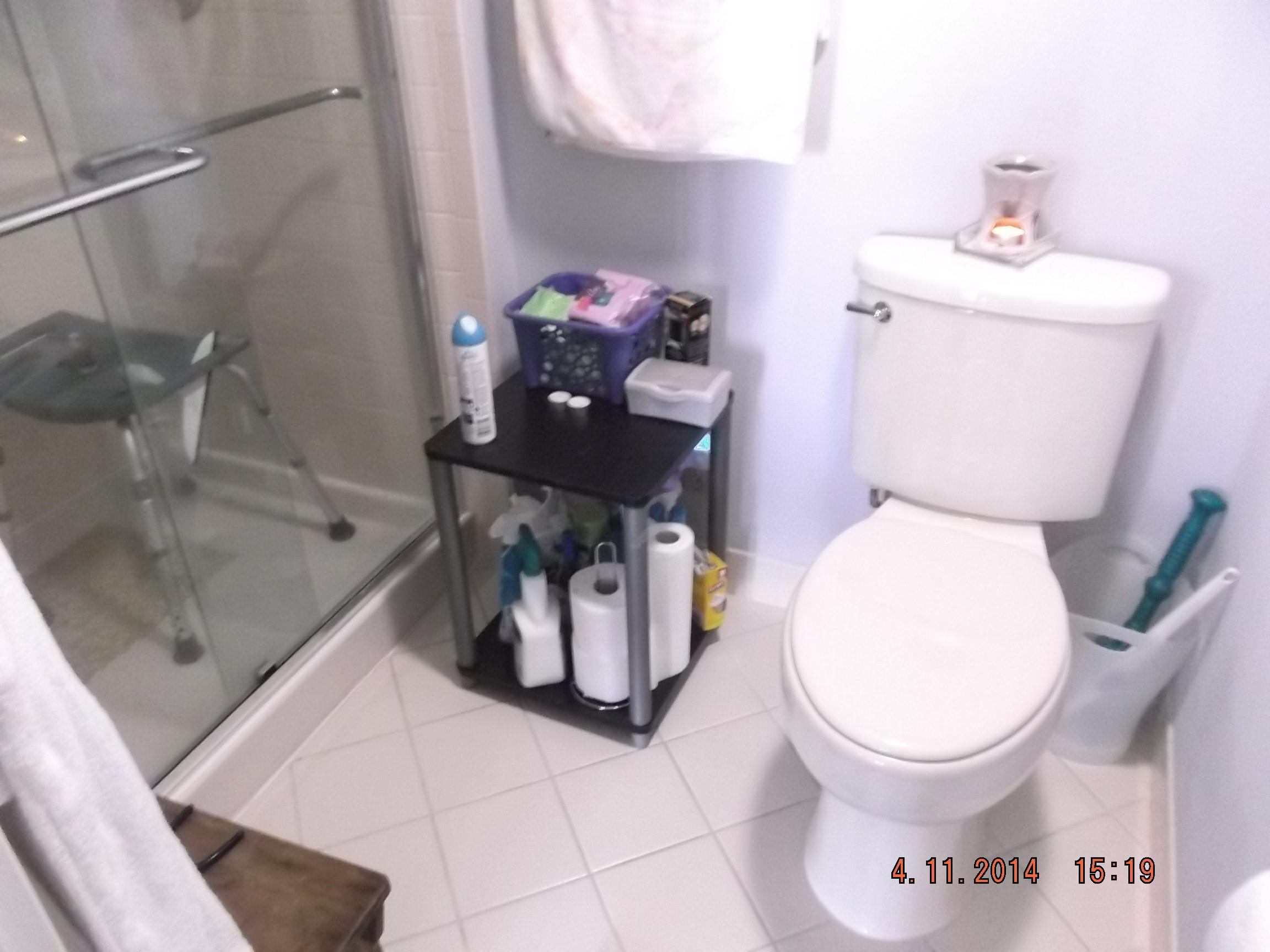 6133 Balboa Circle, Unit 405 Boca Raton, FL 33433 - Photo 19 of 36 a white toilet sitting next to a bathroom sink