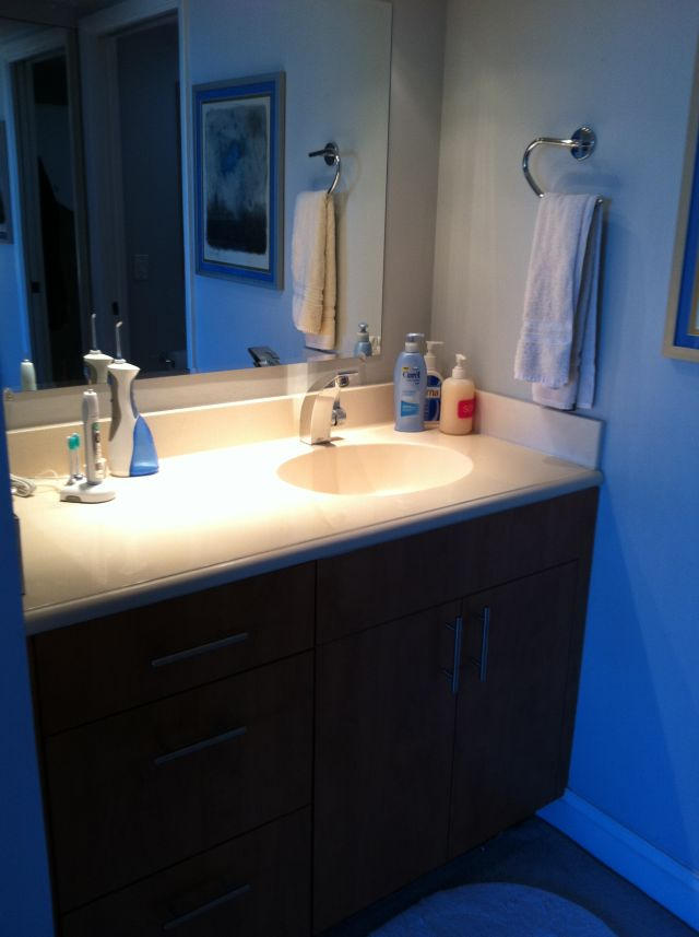 6133 Balboa Circle, Unit 405 Boca Raton, FL 33433 - Photo 20 of 36 a bathroom with a sink and a mirror