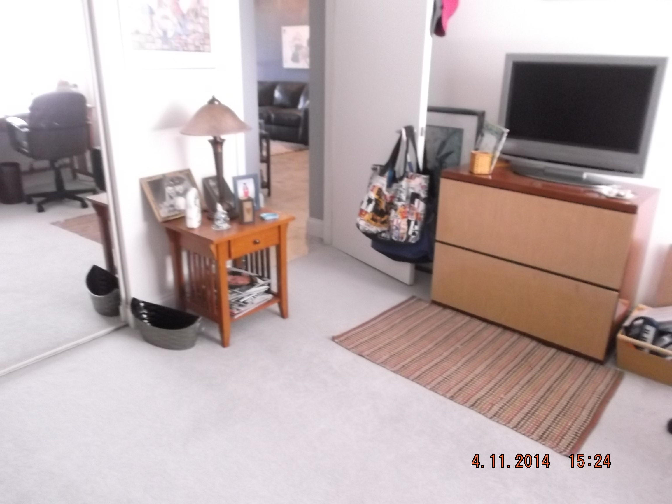 6133 Balboa Circle, Unit 405 Boca Raton, FL 33433 - Photo 24 of 36 a living room with furniture and a flat screen tv
