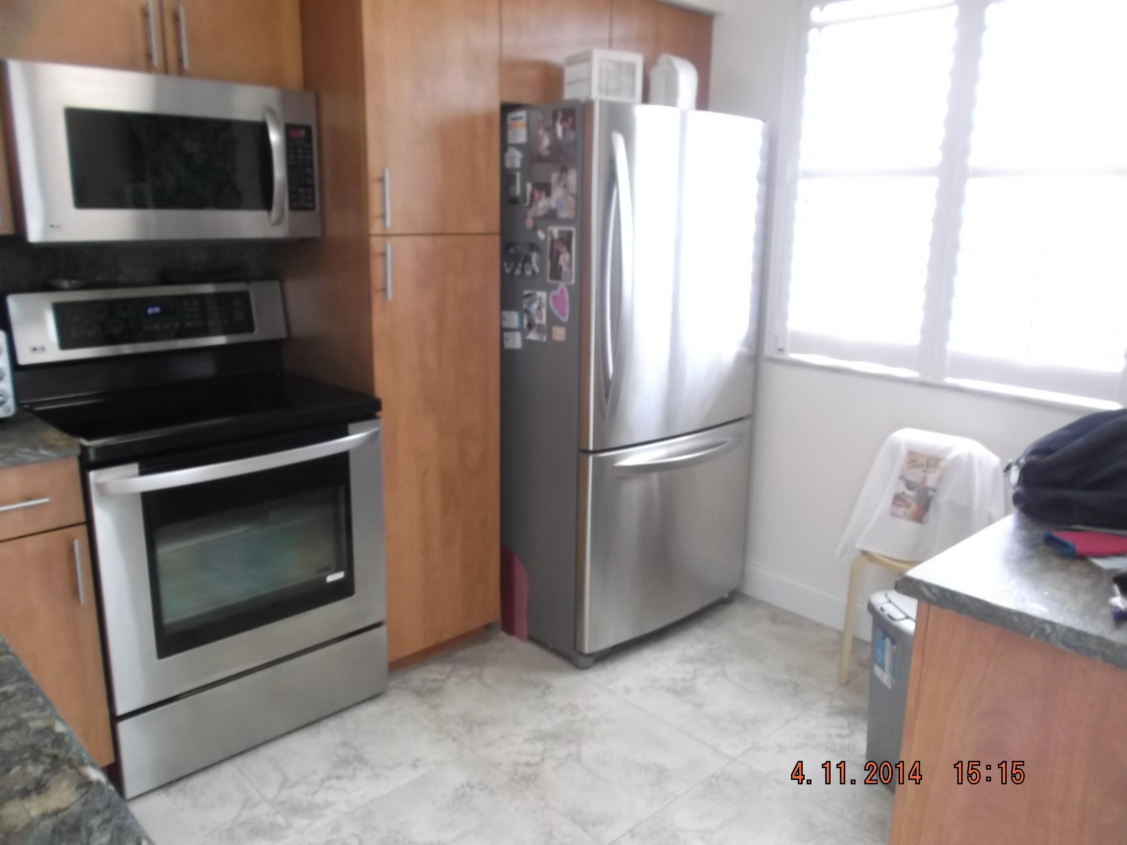 6133 Balboa Circle, Unit 405 Boca Raton, FL 33433 - Photo 3 of 36 a kitchen with a refrigerator and a stove