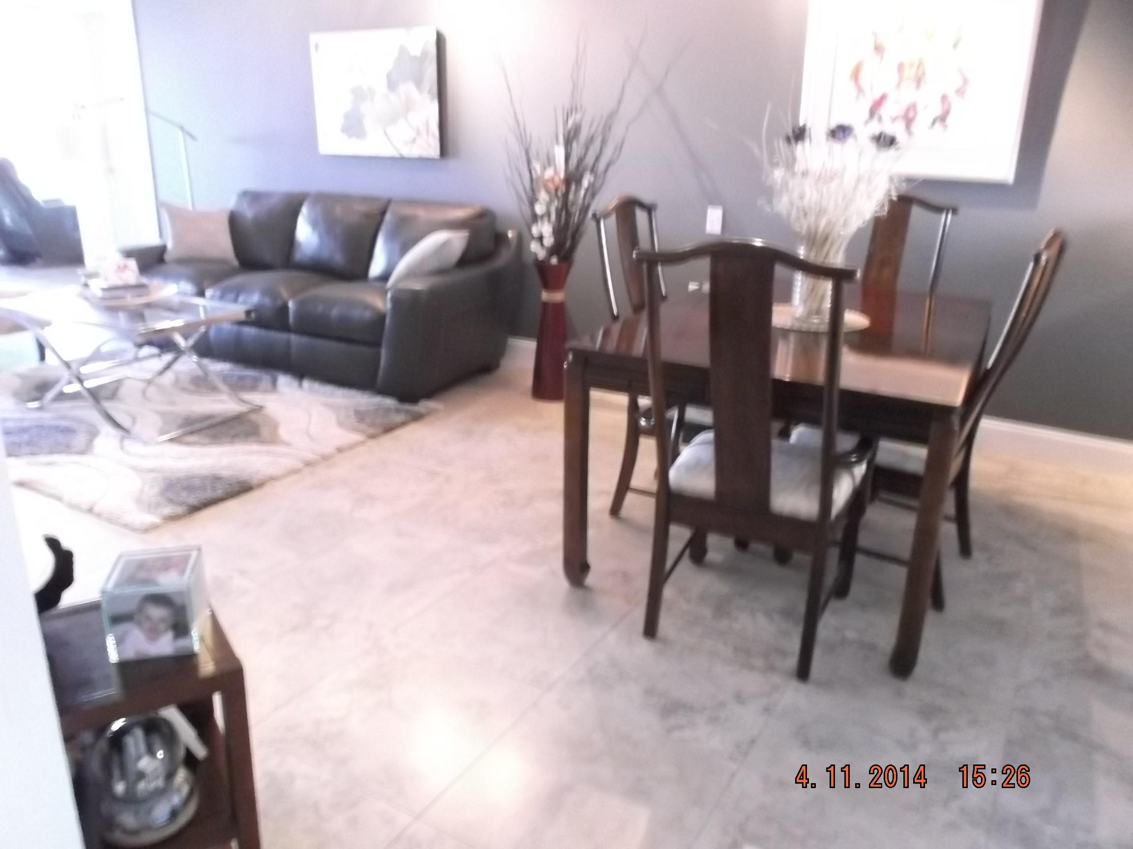6133 Balboa Circle, Unit 405 Boca Raton, FL 33433 - Photo 8 of 36 a view of a livingroom with furniture and a potted plant