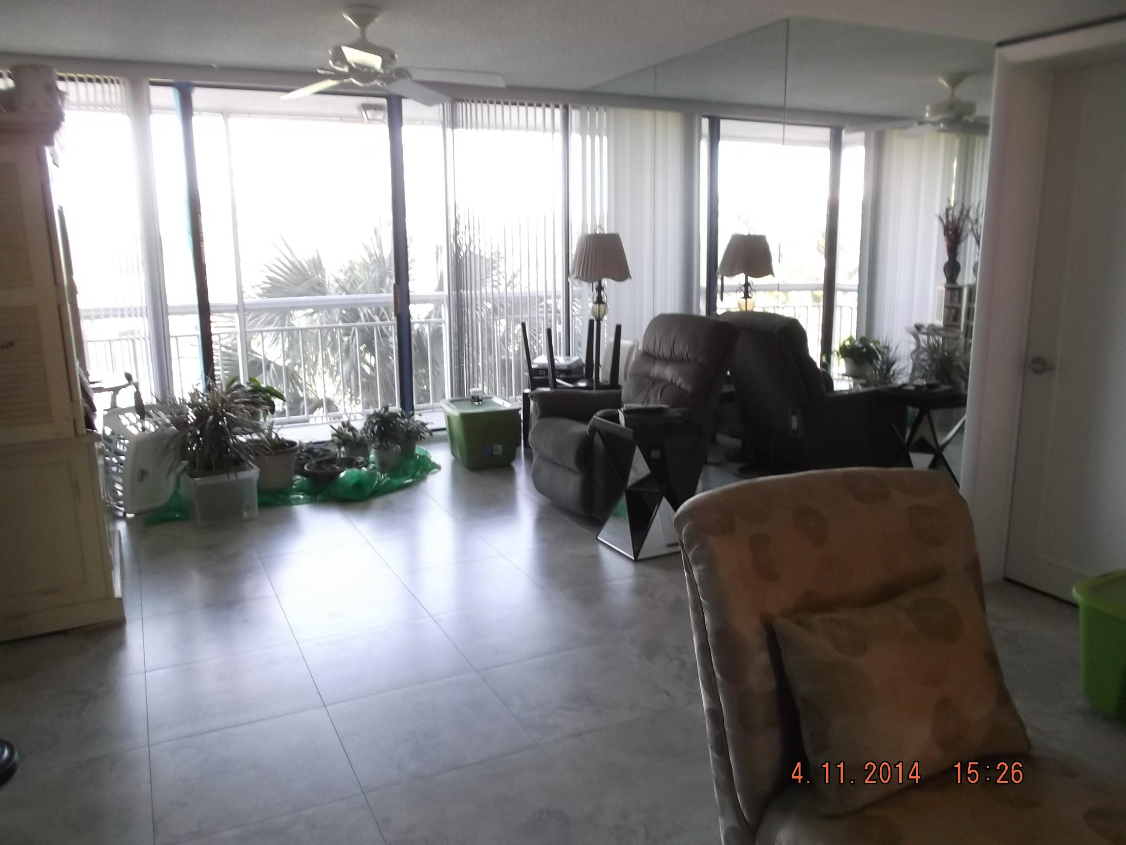 6133 Balboa Circle, Unit 405 Boca Raton, FL 33433 - Photo 10 of 36 a living room with furniture and a large window