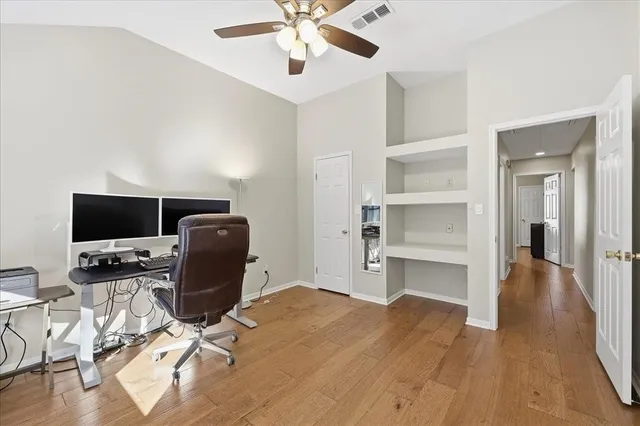 a bathroom with a granite countertop sink a toilet and a mirror