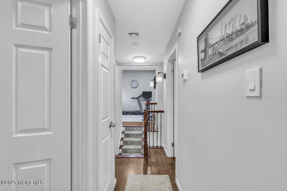 14 Starlight Road Howell, NJ 07731 - Photo 26 of 71 a view of a hallway with wooden floor and entryway