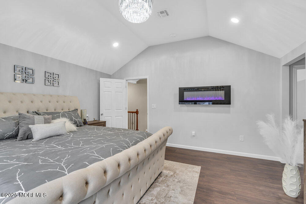 14 Starlight Road Howell, NJ 07731 - Photo 32 of 71 a living room with a bed and a couch