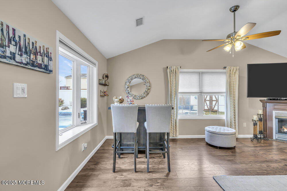 14 Starlight Road Howell, NJ 07731 - Photo 40 of 71 a view of a livingroom with furniture a flat screen tv and a large window