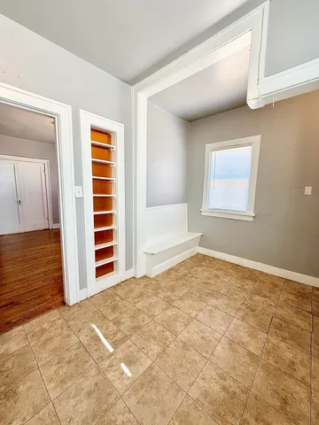 a view of an empty room with a window