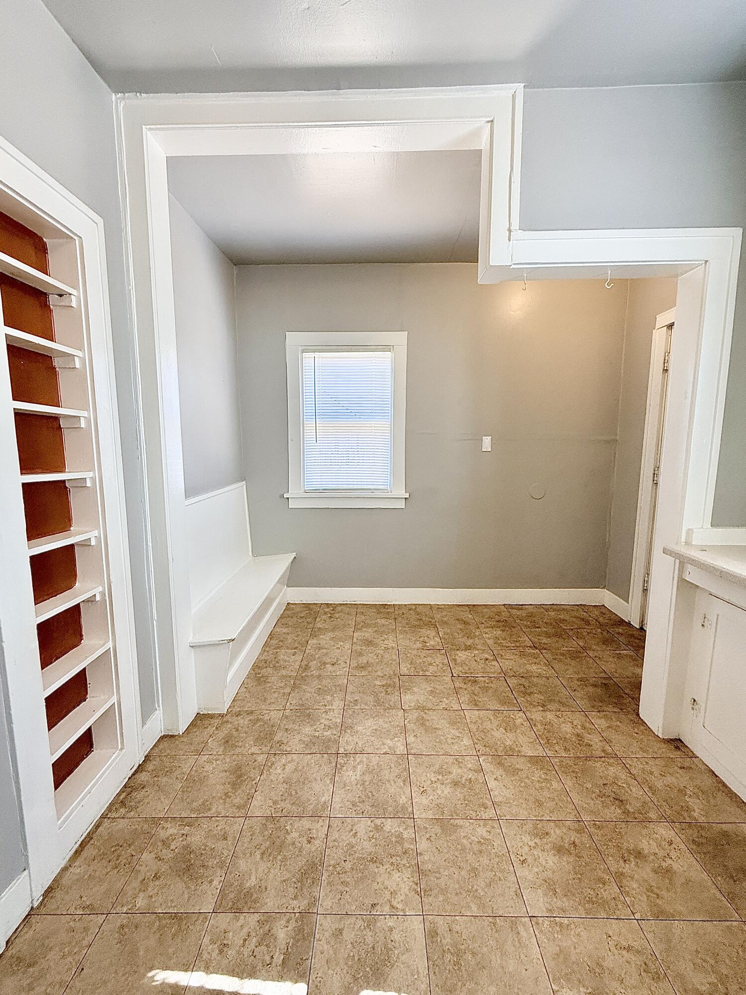 2105 14th Street, Unit 2 Lubbock, TX 79401 - Photo 14 of 15 a view of a room with a sink and cabinets
