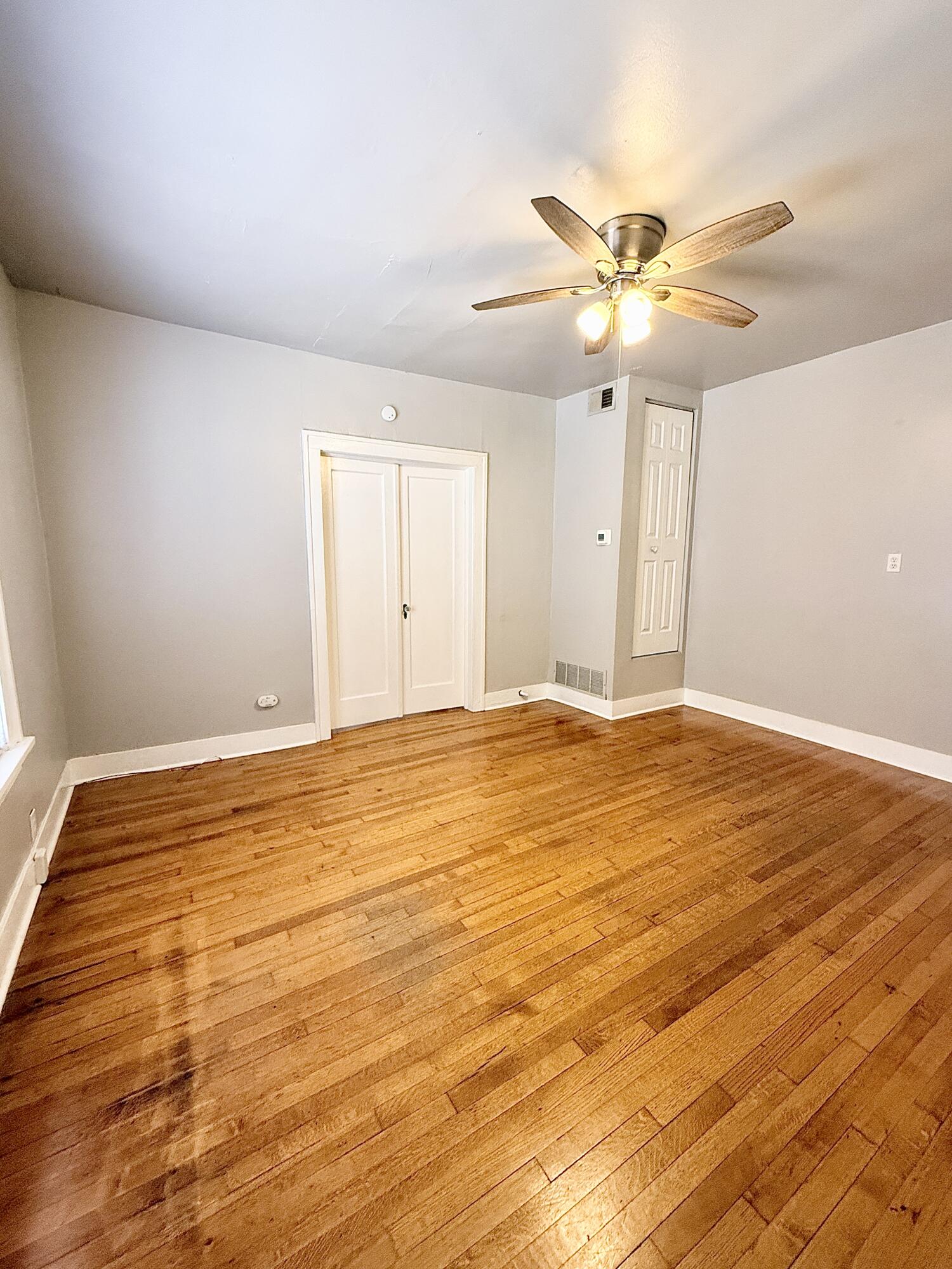2105 14th Street, Unit 2 Lubbock, TX 79401 - Photo 6 of 15 a view of a room with wooden floor