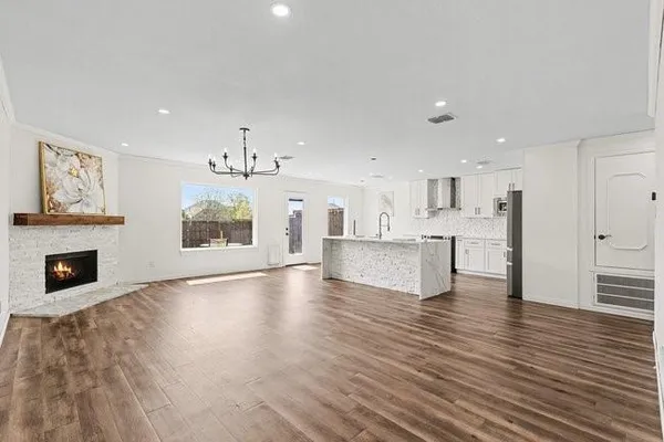 a view of a kitchen with furniture and a fireplace
