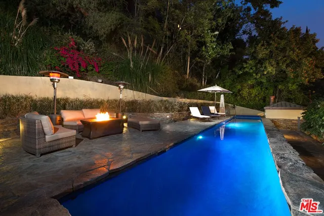 a view of a swimming pool with a patio