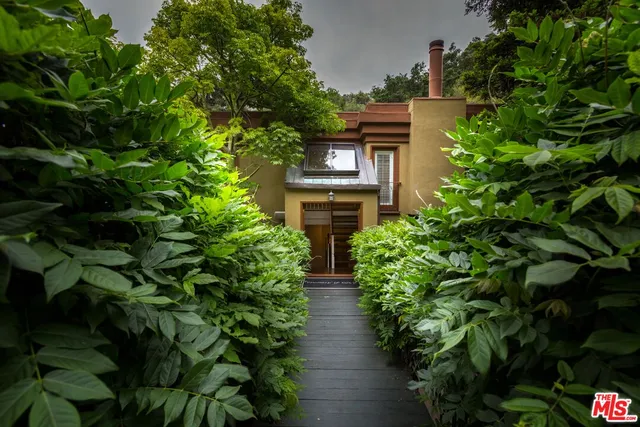 a view of outdoor sitting area with furniture and tree