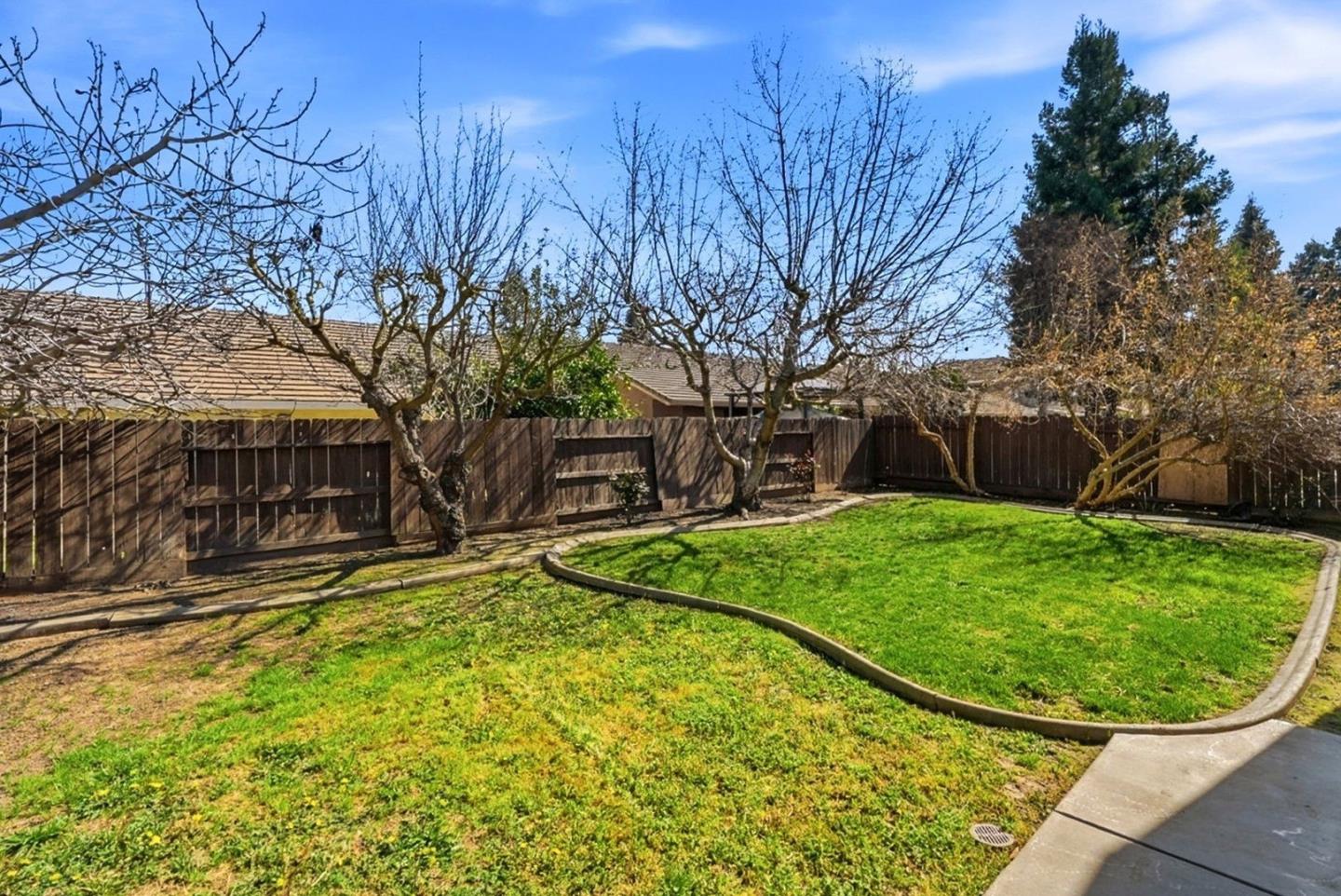 3882 Pintail Court Merced, CA 95340 - Photo 21 of 21 a view of a backyard with a garden