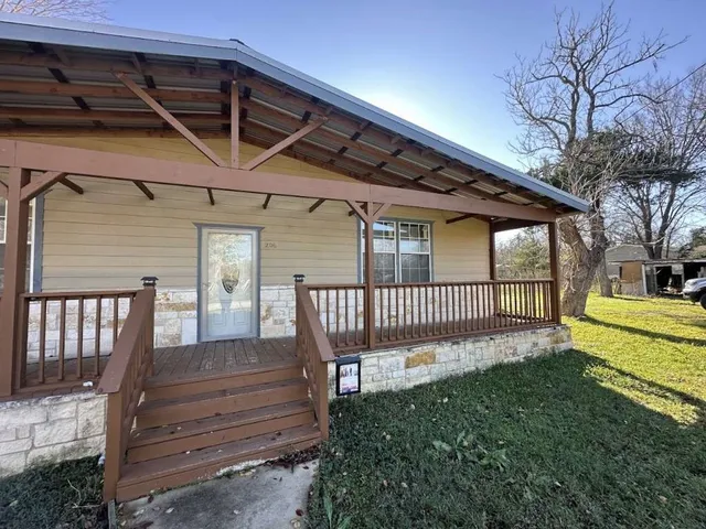 a view of a deck with a backyard