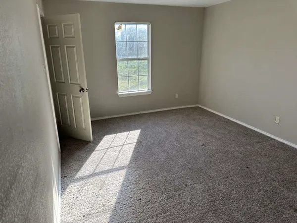 an empty room with windows