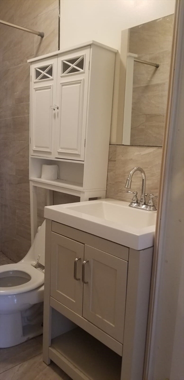 36 Gordon Street Boston, MA 02134 - Photo 6 of 14 a bathroom with a sink a toilet and shower
