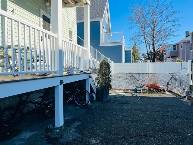 a table and chairs in front of a house