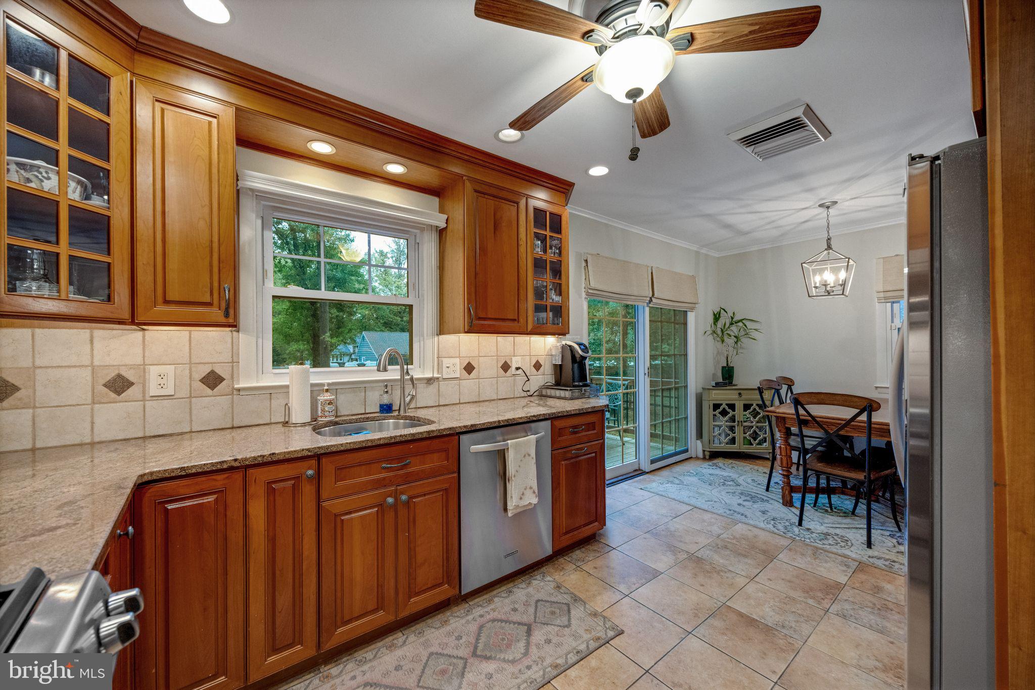 12 Cooper Run Drive Cherry Hill, NJ 08003 - Photo 12 of 50 a kitchen with a sink dining table and chairs