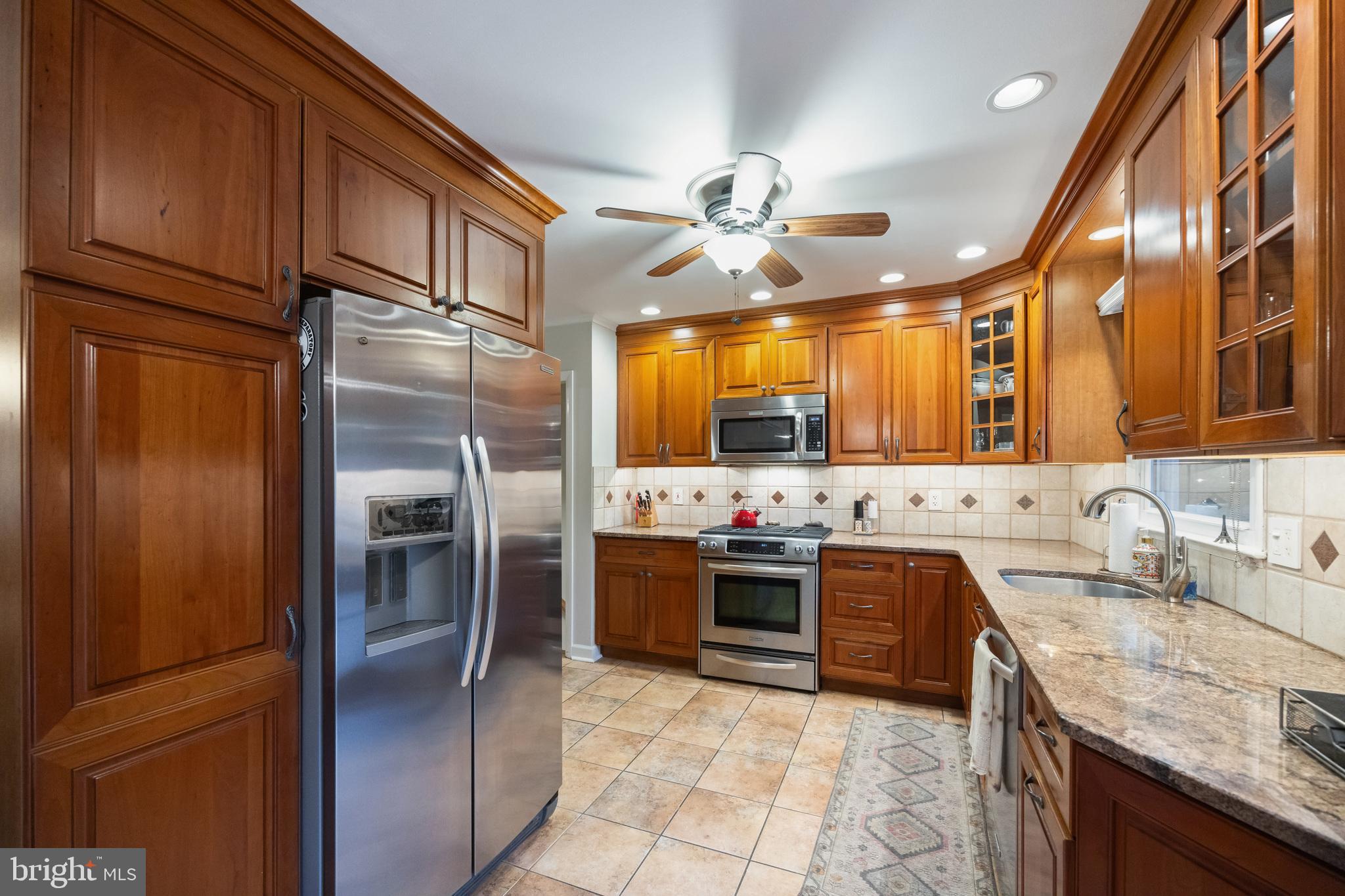 12 Cooper Run Drive Cherry Hill, NJ 08003 - Photo 14 of 50 a kitchen with stainless steel appliances granite countertop a sink stove and refrigerator