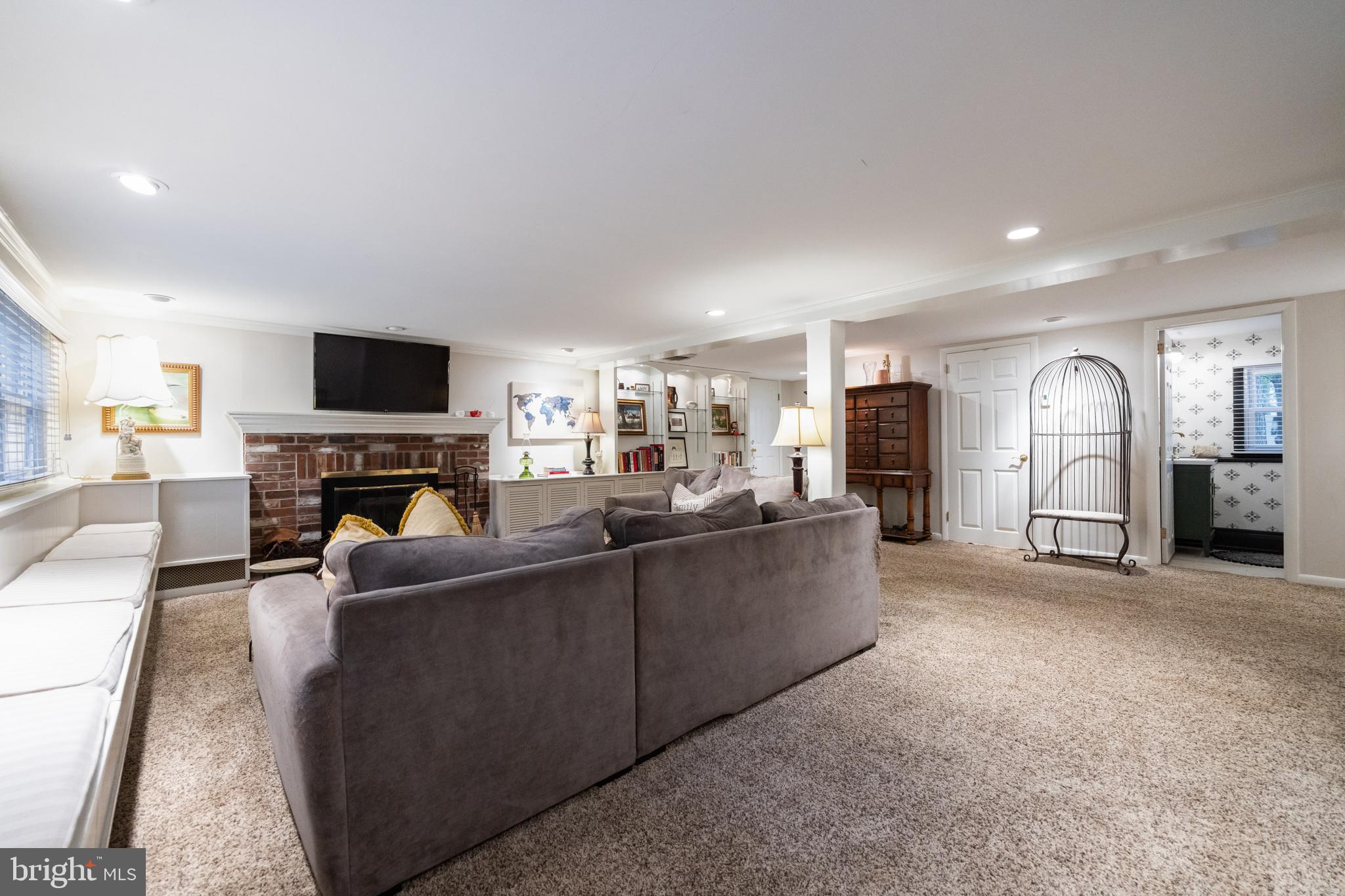12 Cooper Run Drive Cherry Hill, NJ 08003 - Photo 20 of 50 a living room with furniture a fireplace and a flat screen tv