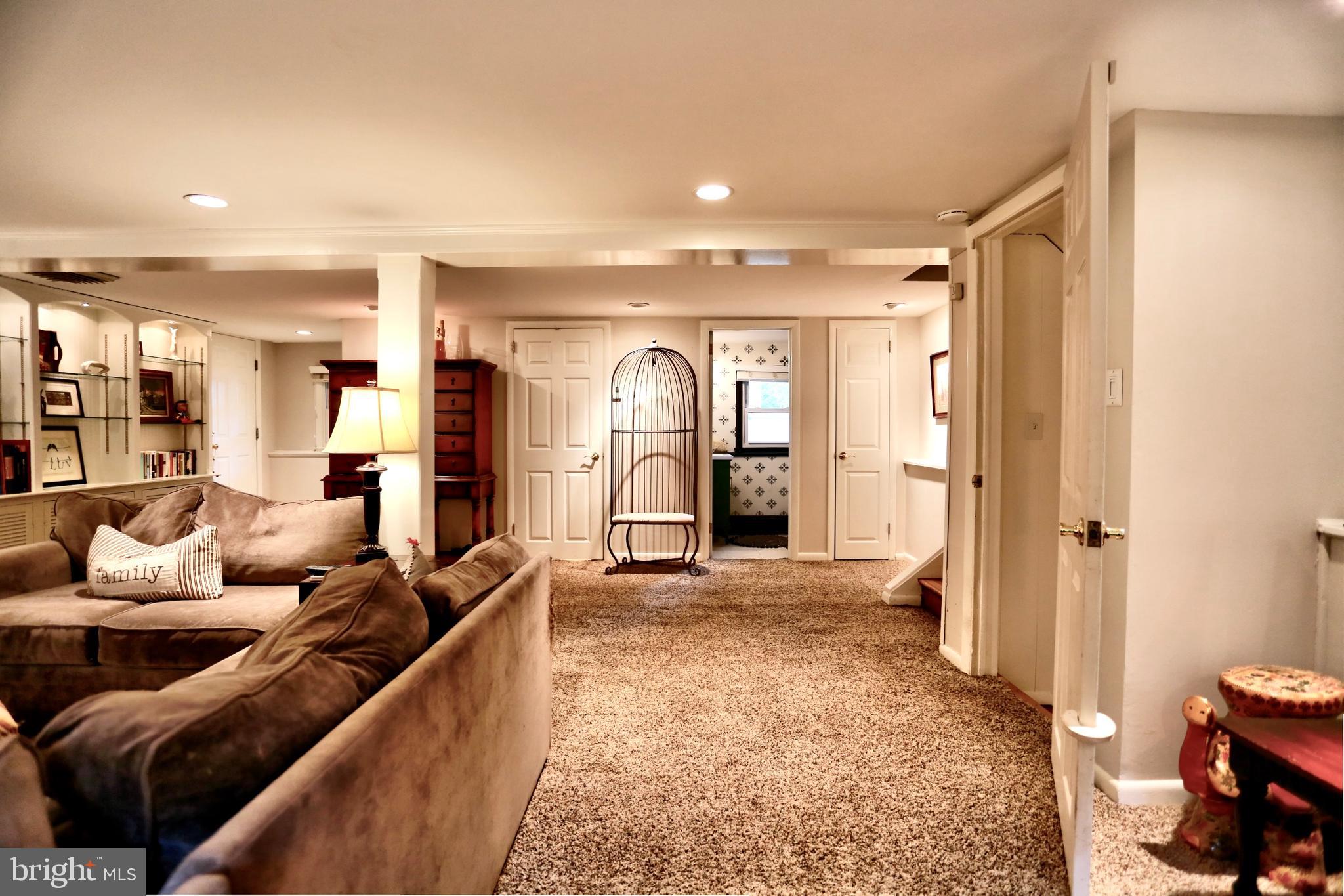 12 Cooper Run Drive Cherry Hill, NJ 08003 - Photo 21 of 50 a living room with furniture a dining table and a refrigerator