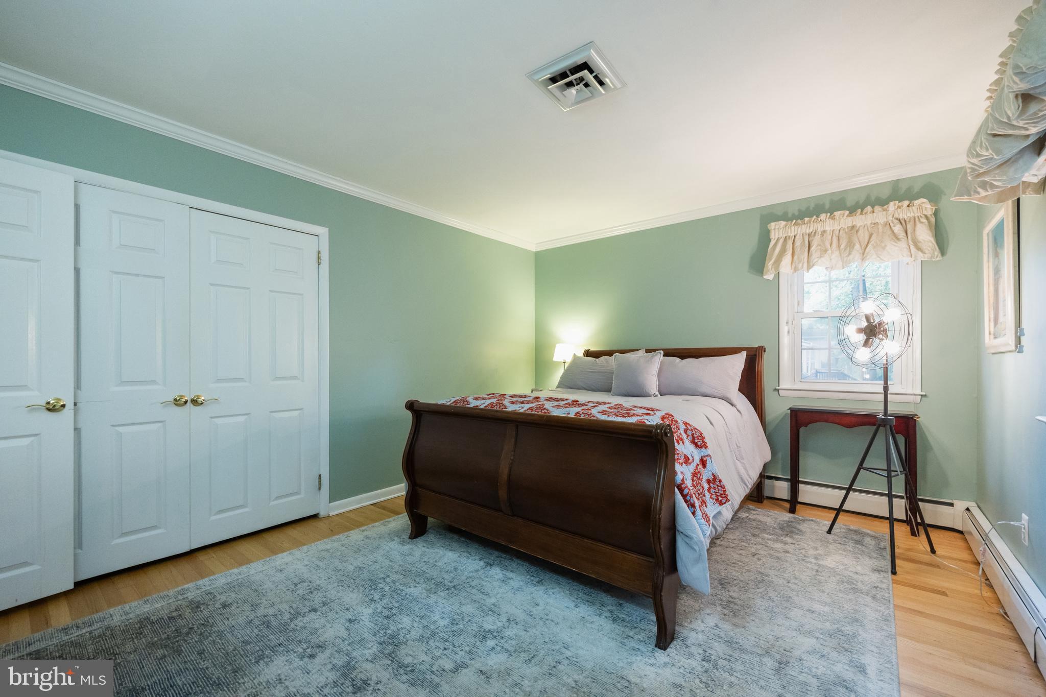 12 Cooper Run Drive Cherry Hill, NJ 08003 - Photo 29 of 50 a bedroom with a bed and a table in it