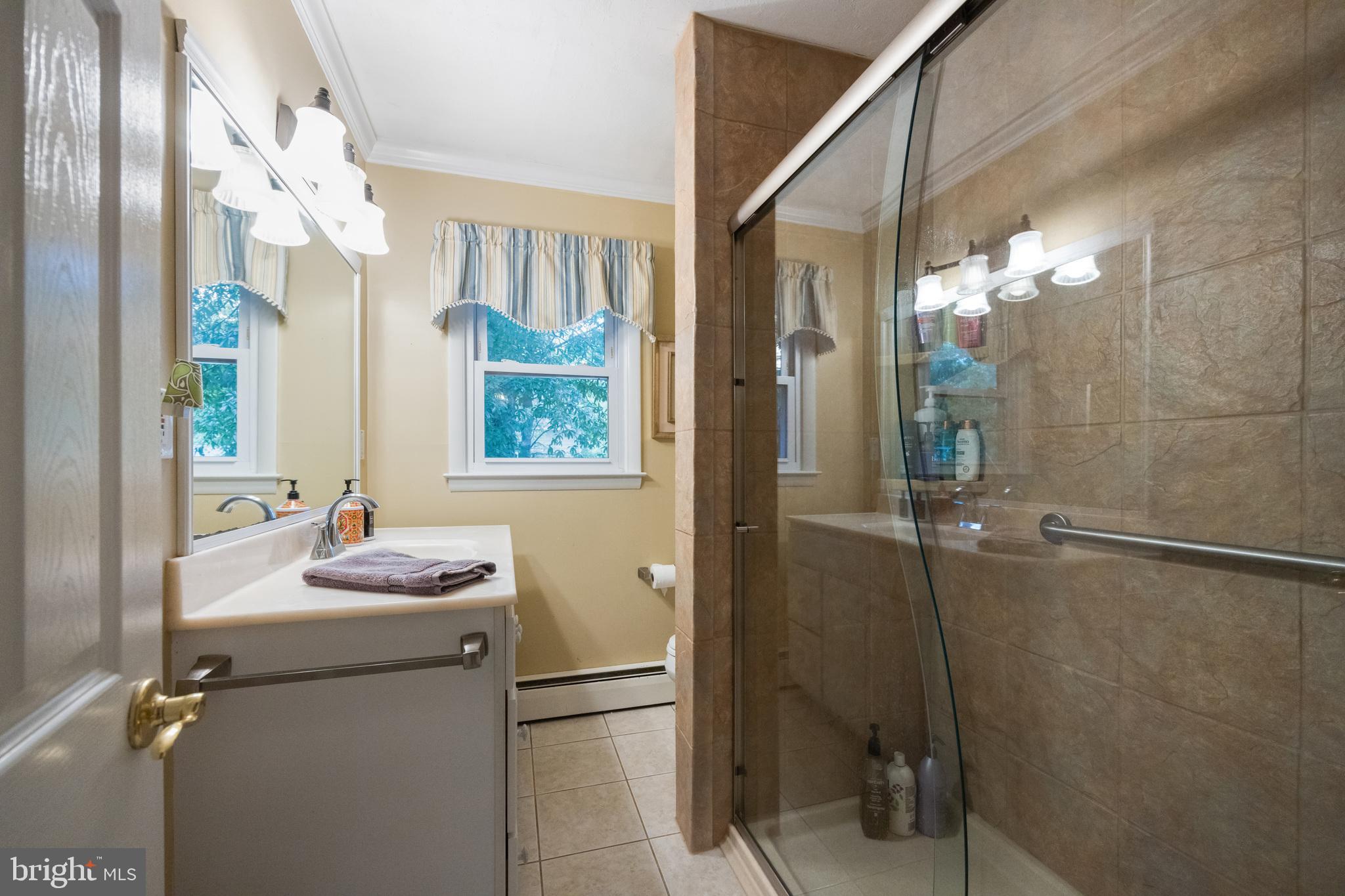 12 Cooper Run Drive Cherry Hill, NJ 08003 - Photo 30 of 50 a bathroom with a sink mirror and a shower