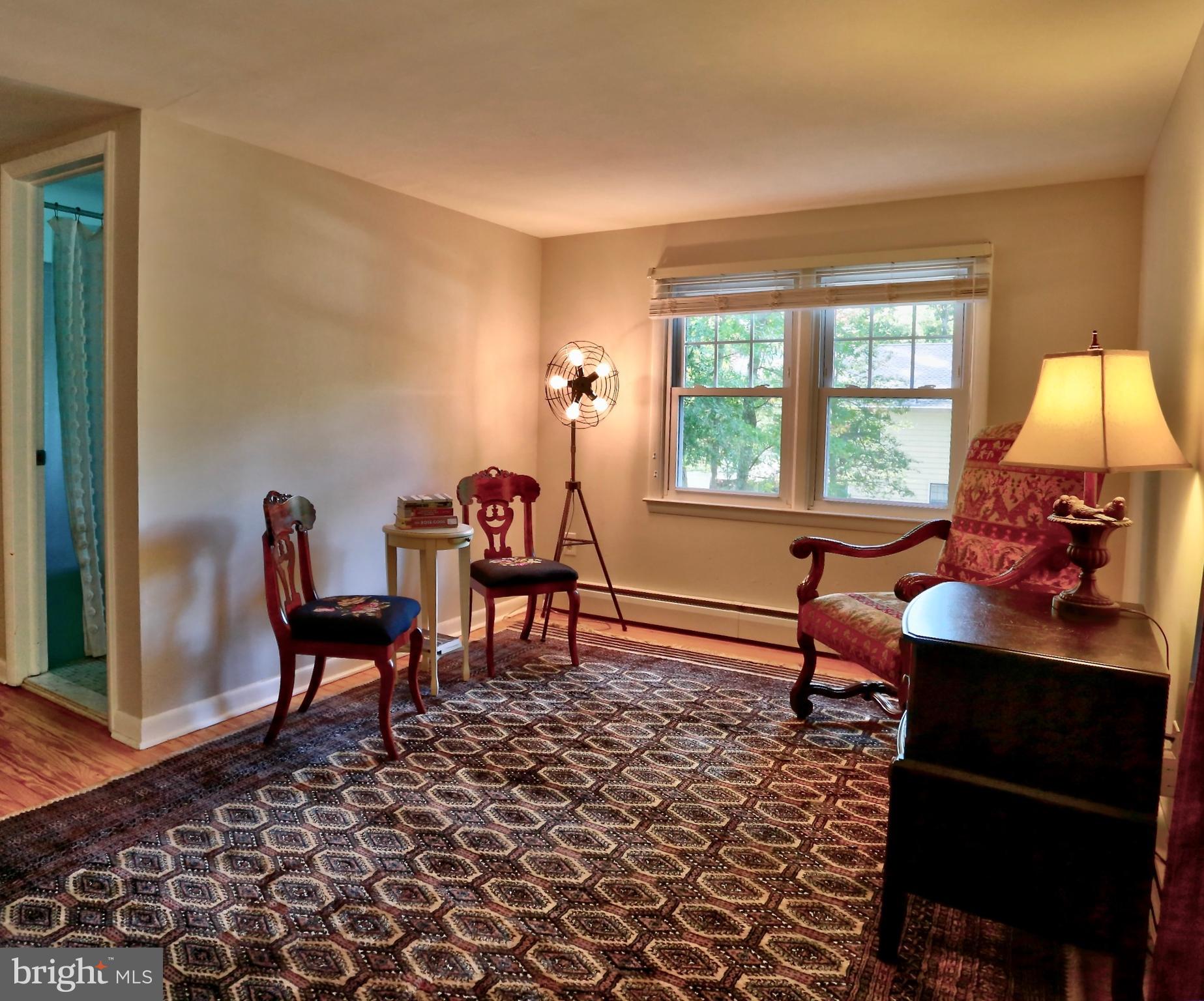 12 Cooper Run Drive Cherry Hill, NJ 08003 - Photo 39 of 50 a living room with furniture a window and a lamp
