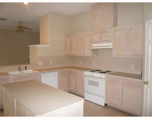 7809 Armstrong Drive Corpus Christi, TX 78413 - Photo 2 of 10 a kitchen with a sink cabinets and appliances