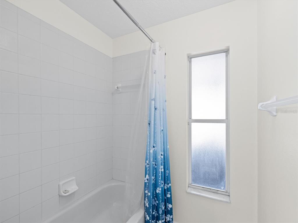 11217 Kangley Lane Spring Hill, FL 34608 - Photo 26 of 43 a bathroom with a bathtub