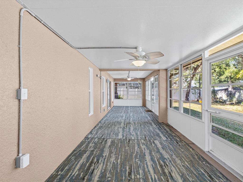 11217 Kangley Lane Spring Hill, FL 34608 - Photo 31 of 43 a view of gallery with wooden floor