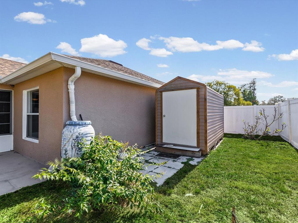 11217 Kangley Lane Spring Hill, FL 34608 - Photo 39 of 43 a front view of a house with garden