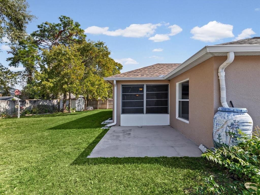 11217 Kangley Lane Spring Hill, FL 34608 - Photo 40 of 43 a front view of a house with a garden