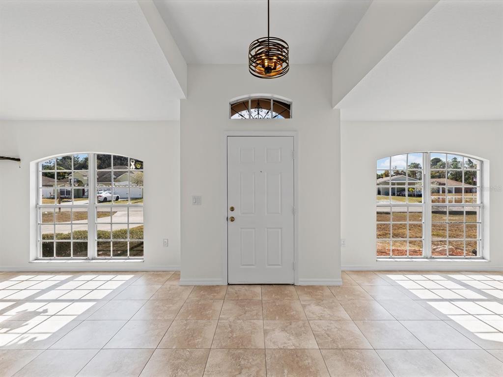11217 Kangley Lane Spring Hill, FL 34608 - Photo 8 of 43 a view of an empty room with a window