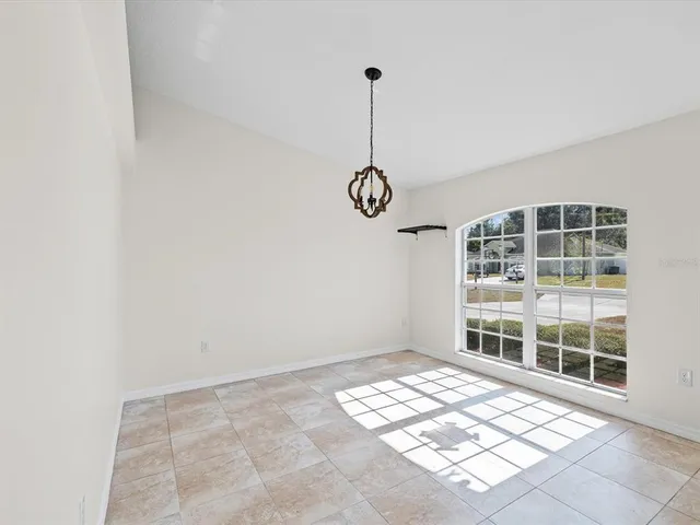 a view of an empty room with windows