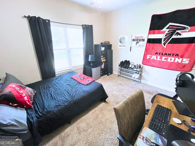 a bedroom with a bed and a couch