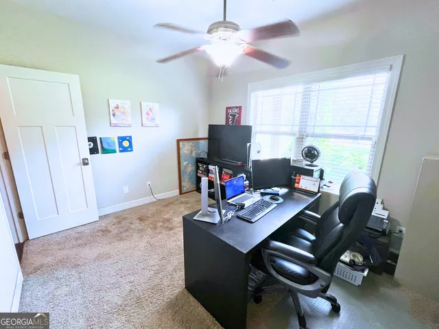 a workspace with furniture and window