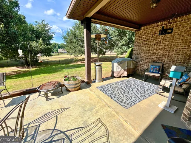 a view of swimming pool with outdoor seating