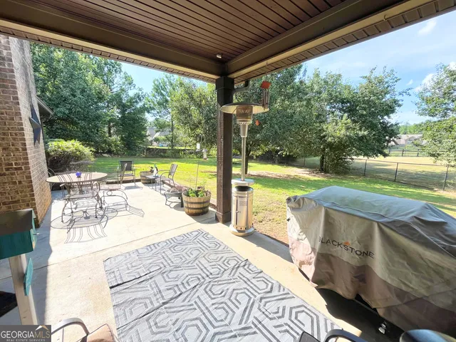 a view of a swimming pool with a patio
