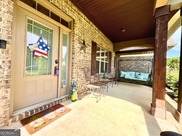 a swimming pool with outdoor seating and yard