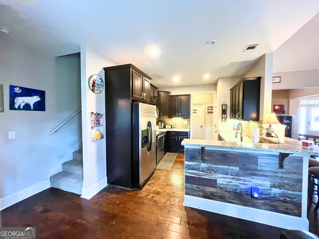 a view of living room and kitchen