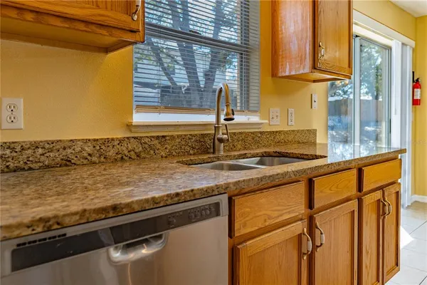 a kitchen with a sink and a window