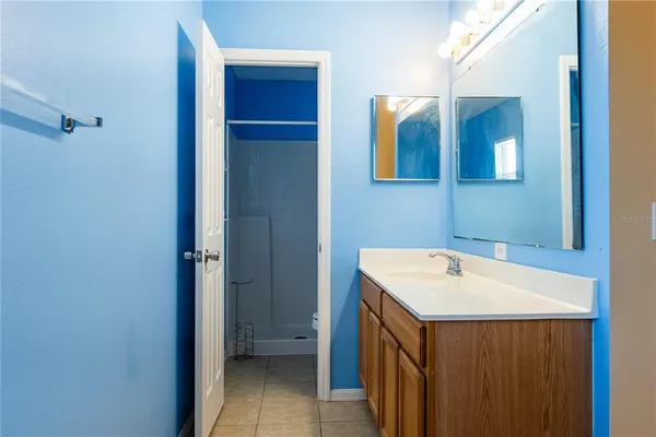 a bathroom with a sink a mirror and a toilet