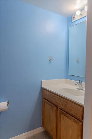 a bathroom with a sink and vanity