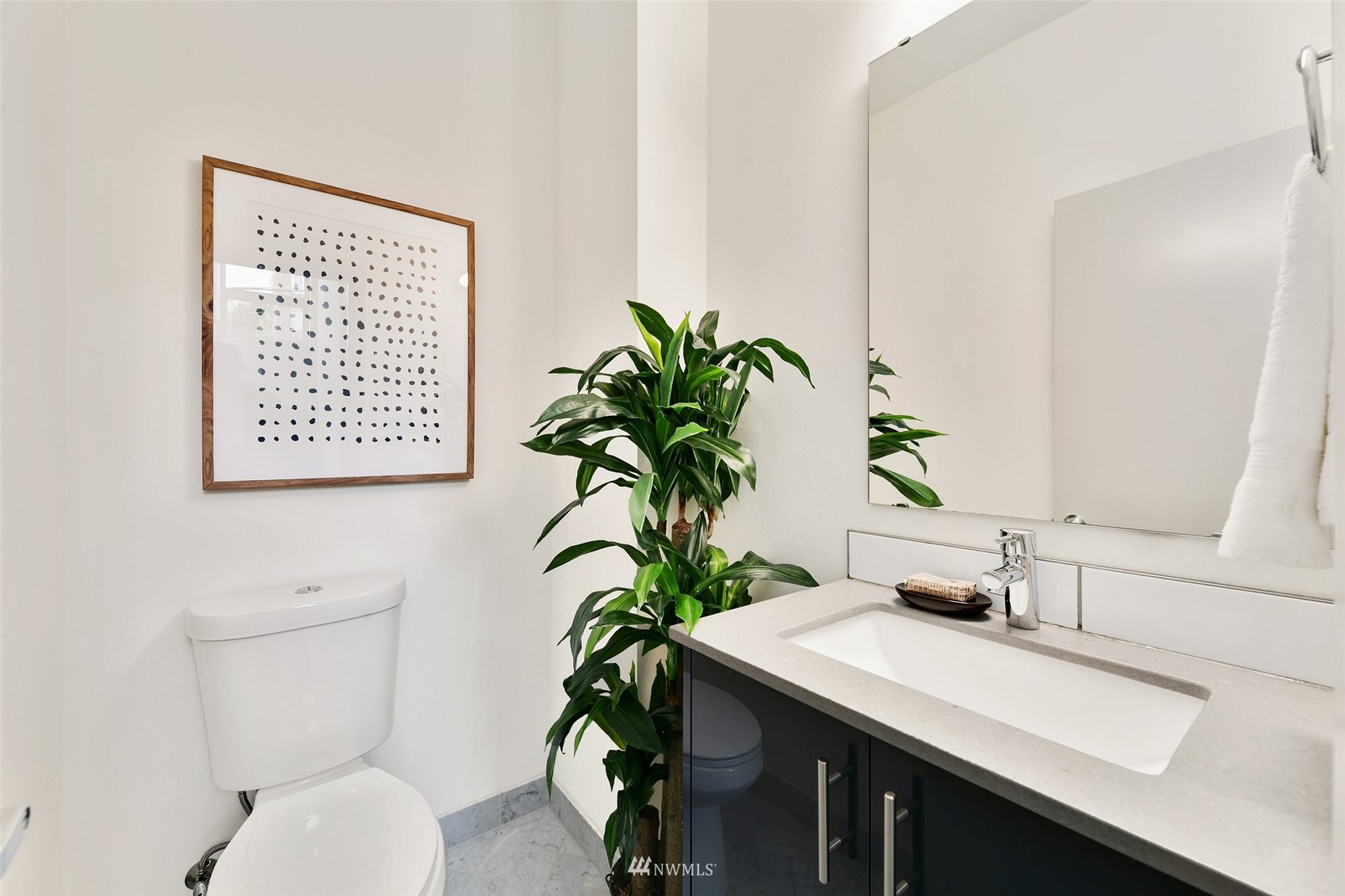 327 West Olympic Place, Unit F Seattle, WA 98119 - Photo 11 of 39 a bathroom with a toilet a sink and a mirror